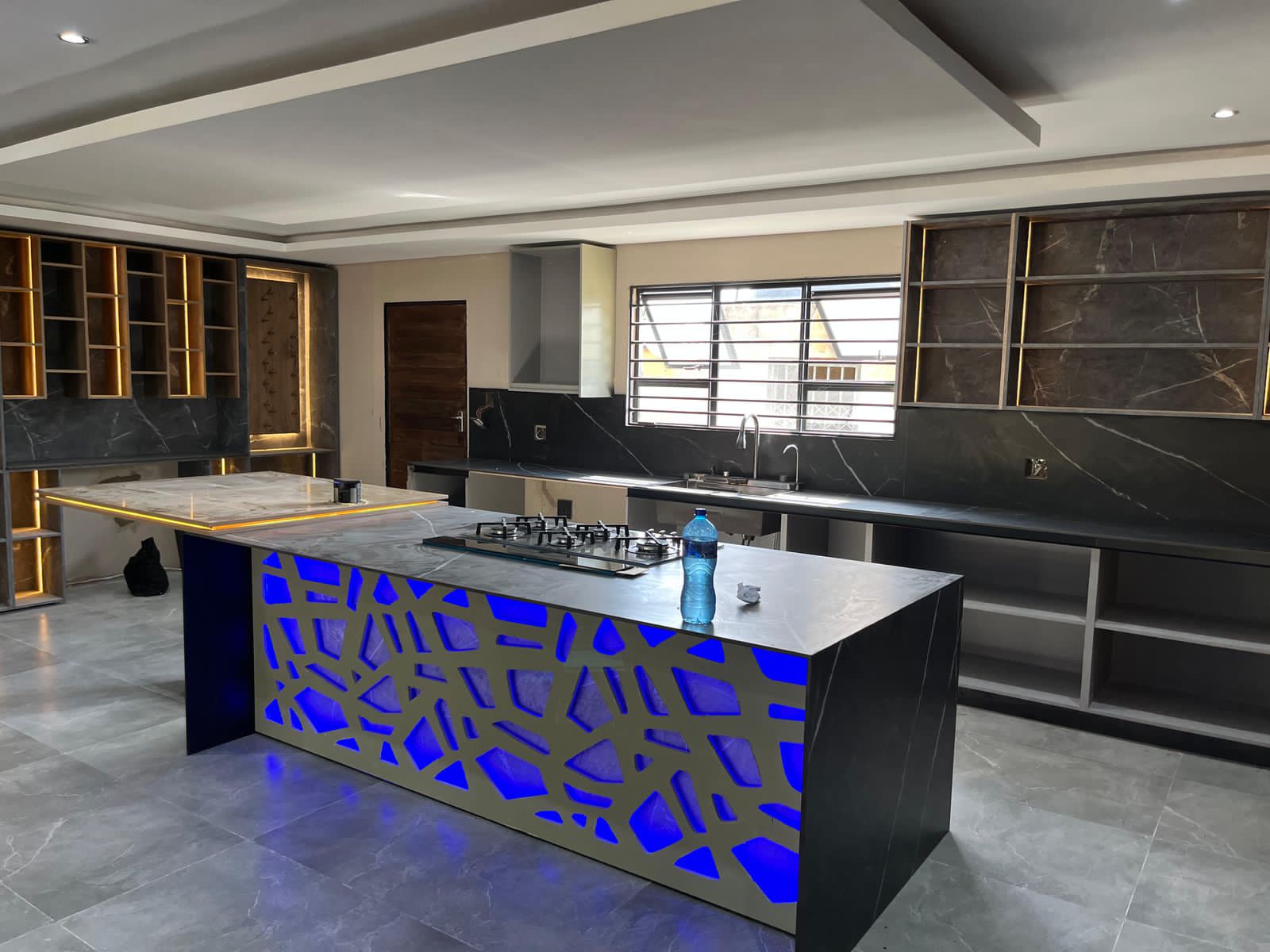 Custom kitchen with backlit feature island